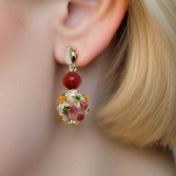 Handmade Floral Elegance Earrings featuring intricate floral lamp work glass beads and soft pink rhodonite accents. A romantic and meaningful accessory, perfect as a gift or personal statement piece.