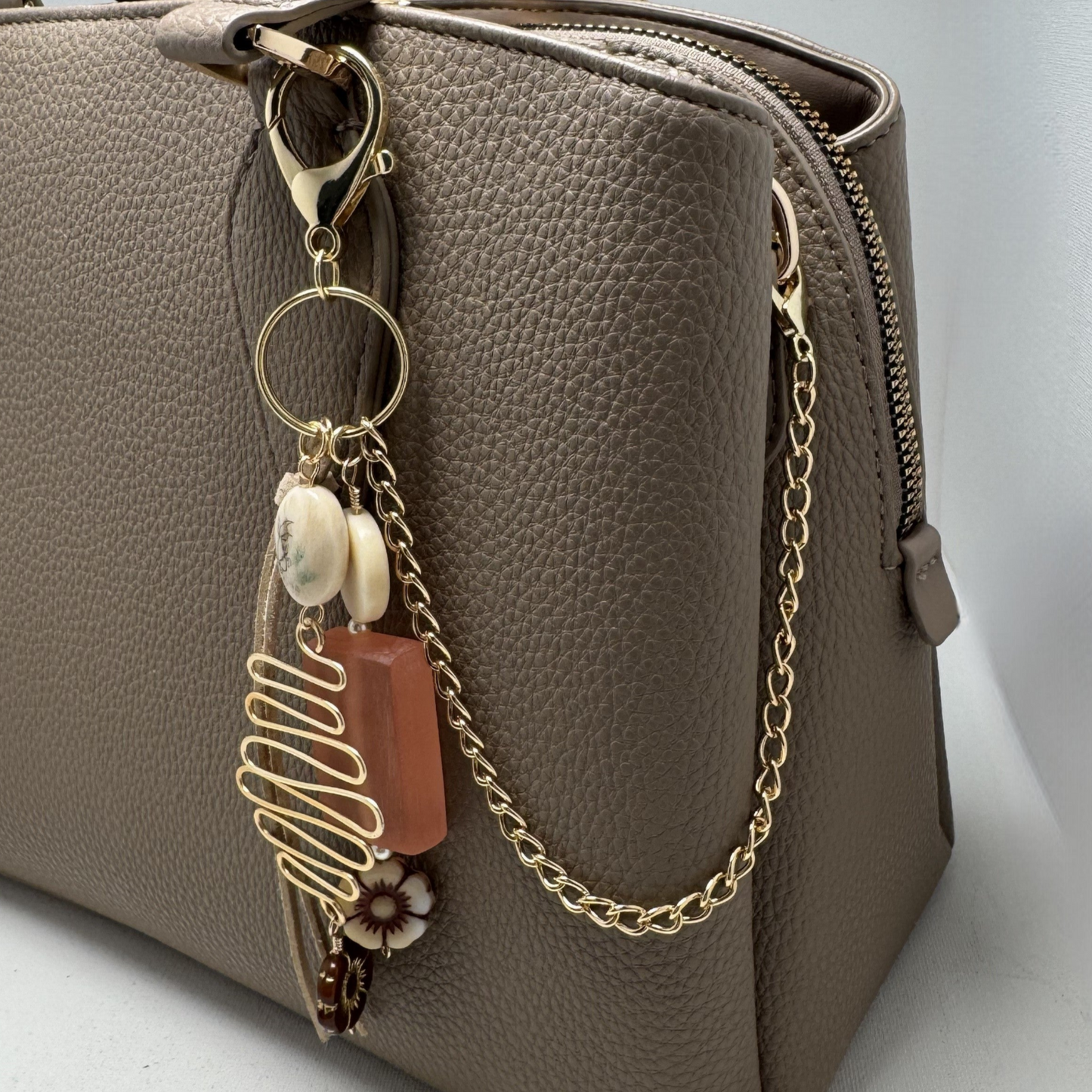 Handmade Bohème Purse Charm with glass bead, ceramic flower charms, vintage bead, and gold-tone chain. Clips onto purses, backpacks, and more.