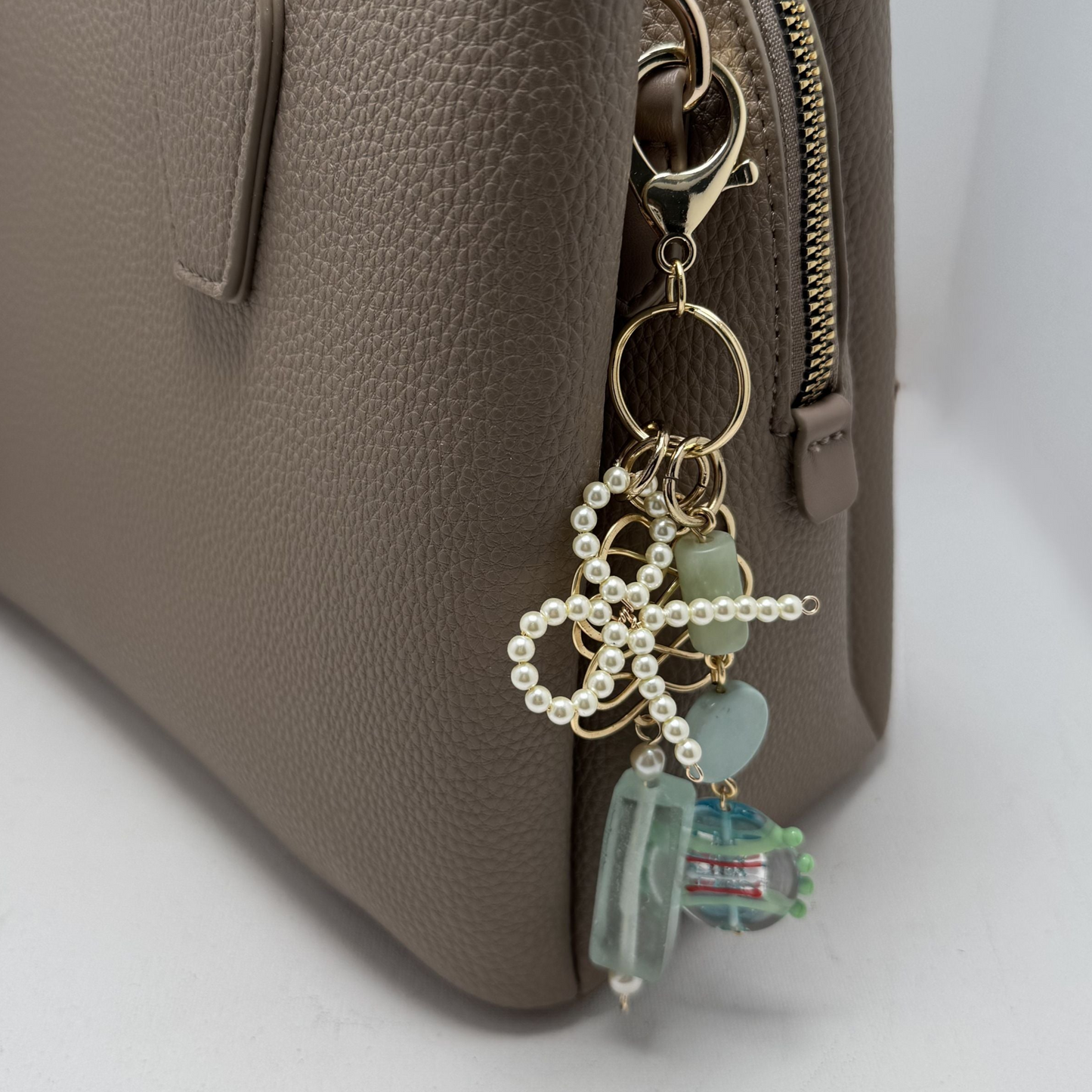 beautiful purse accessory to clip to purses, backpacks, jean loops or belts. Handmade with glass, pearl and natural stones.