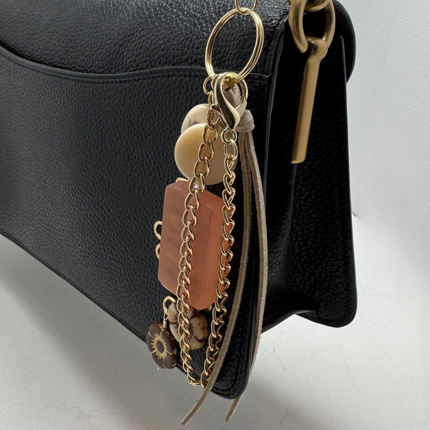 Handmade Bohème Purse Charm with glass bead, ceramic flower charms, vintage bead, and gold-tone chain. Clips onto purses, backpacks, and more.