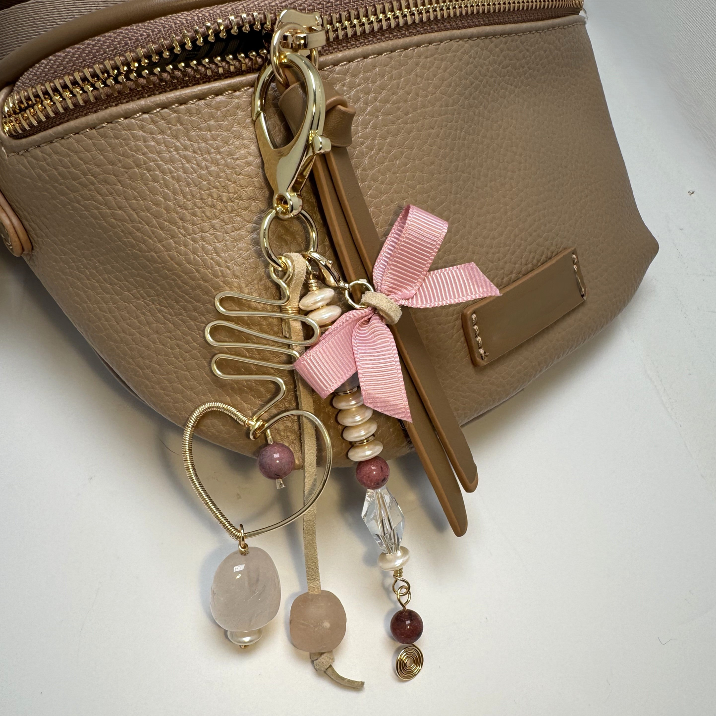 Handmade purse charm with rose quartz, sea glass, rhodonite, faux pearl, and a hand-forged wire-wrapped heart pendant.