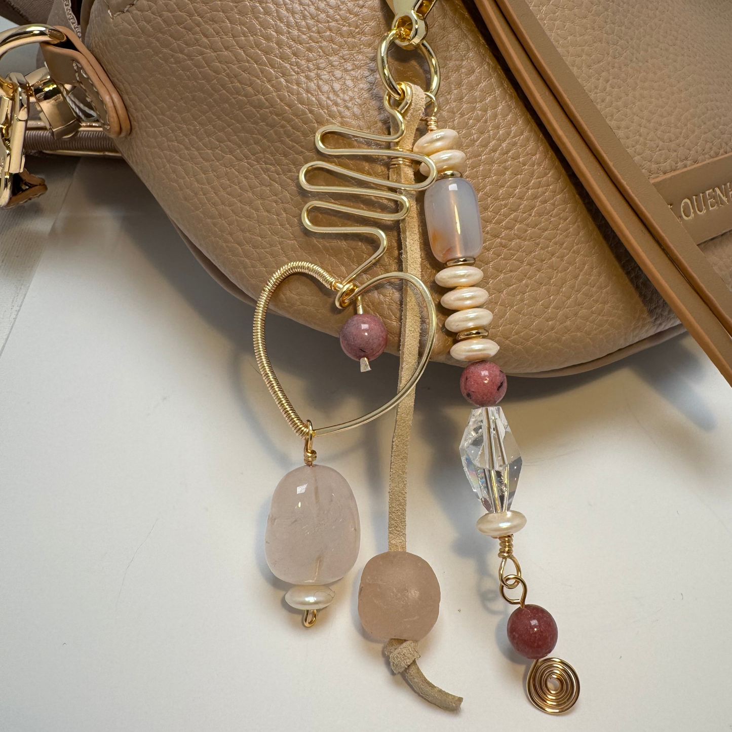 Handmade purse charm with rose quartz, sea glass, rhodonite, faux pearl, and a hand-forged wire-wrapped heart pendant.