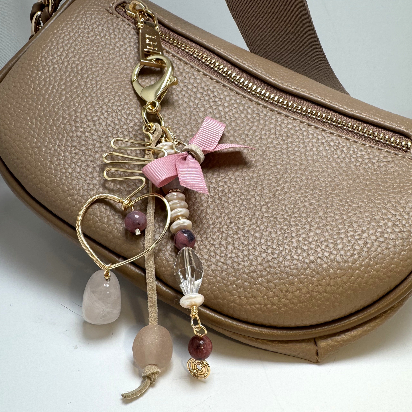 Handmade purse charm with rose quartz, sea glass, rhodonite, faux pearl, and a hand-forged wire-wrapped heart pendant.