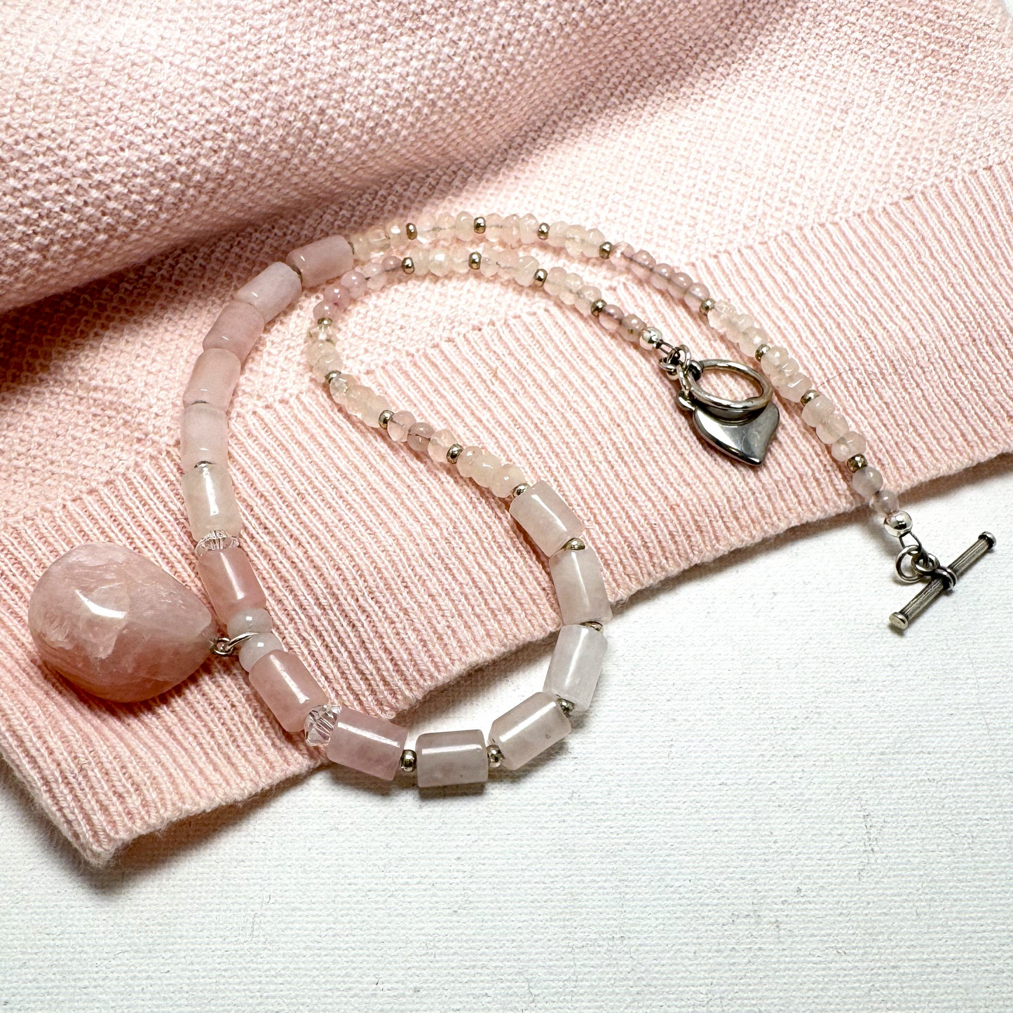 A delicate handmade rose quartz Y-necklace with silver accents, designed for layering or wearing alone. Featuring the "Love Stone," rose quartz is believed to open the heart to love and healing. Handmade in Canada.