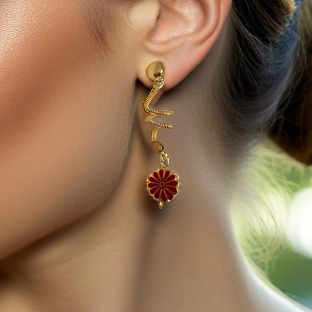 A pair of handcrafted spiral dangle earrings featuring a bold red metal flower accent. These unique earrings add a vibrant and artistic touch to any outfit. Handmade with care by Lacey & Bohème in Canada.