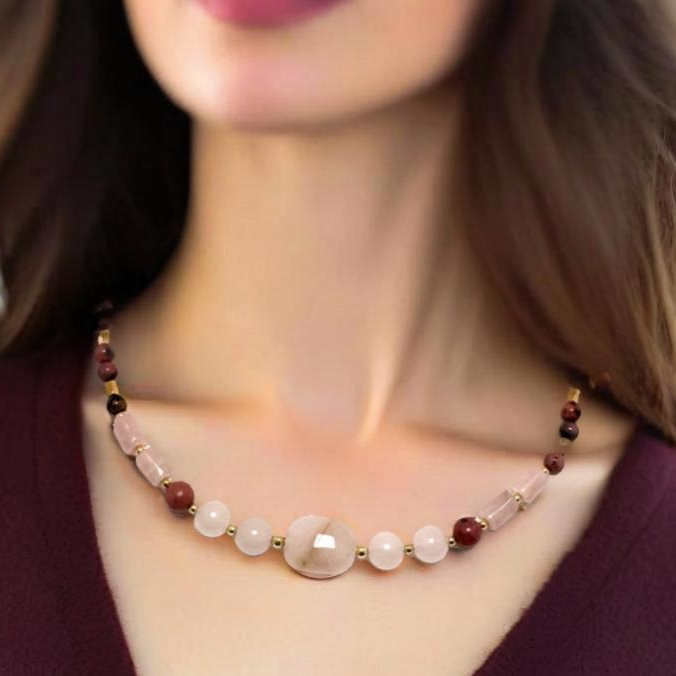 A handcrafted 19-inch necklace featuring soft rose quartz and rich rhodonite, accented with gold-tone details and a hand-forged hook clasp. A timeless piece symbolizing love and compassion, perfect for Valentine's Day or any special occasion.