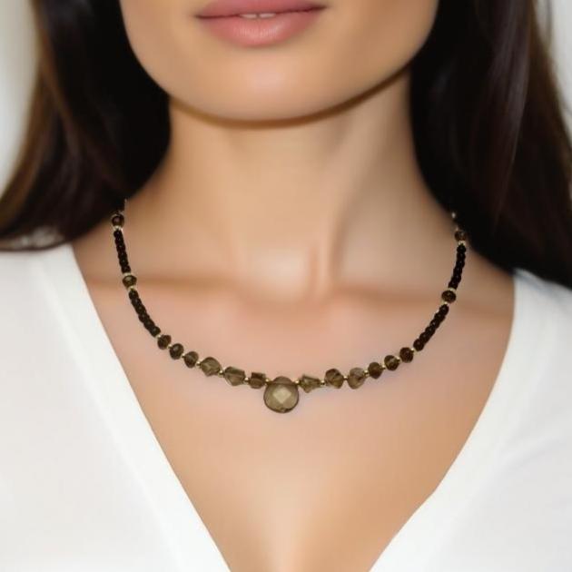 A handcrafted 17.5-inch necklace featuring polished black agate and smoky quartz beads for a sleek, versatile look. Designed for effortless day-to-night styling, this refined piece is finished with a signature handmade hook closure. A modern yet timeless accessory by Lacey & Bohème, perfect for any occasion. Handmade in Canada.