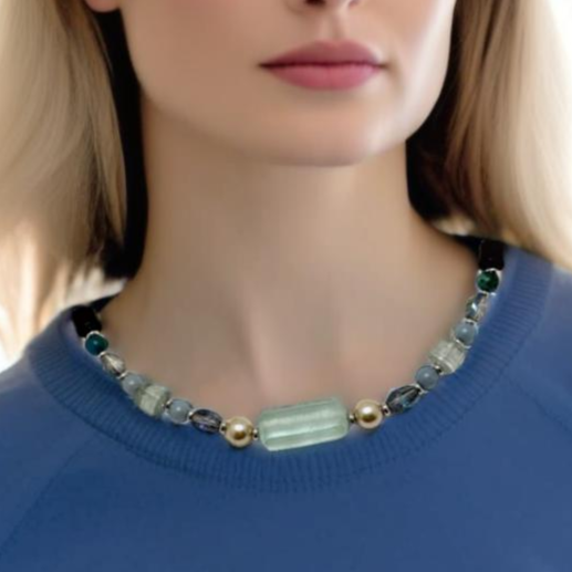 A chunky handmade statement necklace featuring mixed blue stones, including Angelite, Quartz, and Agate, with silver-tone accents and a signature hook clasp. Perfect for pairing with cozy sweaters, this modern and chic piece transitions effortlessly from casual to dressy occasions. Handmade by Lacey & Bohème in Canada.