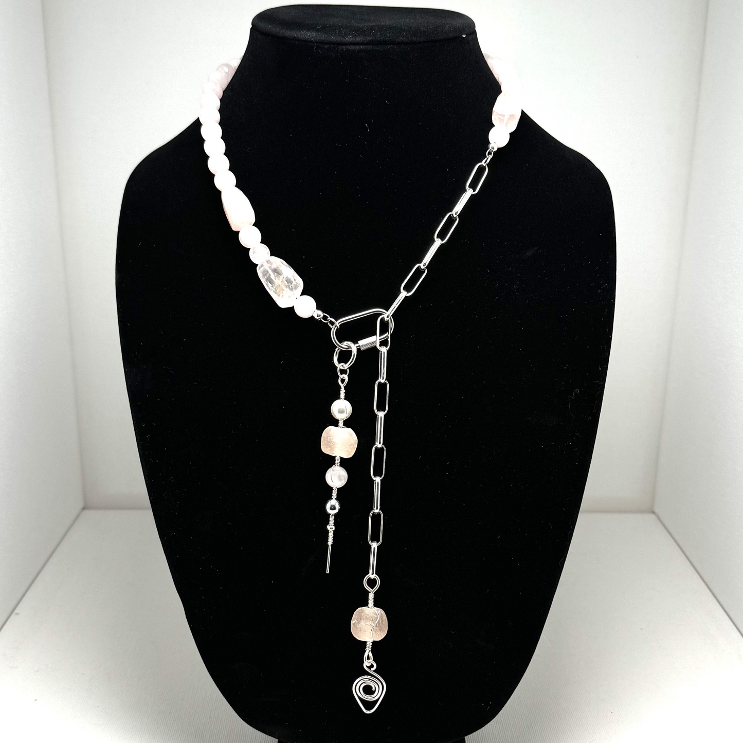 A handcrafted layering necklace featuring rose quartz and pink sea glass, designed for versatility and elegance. Known as the stone of love, rose quartz promotes healing and balance. Adjustable, with an 18-inch (46 cm) neck length and a 6-inch (15 cm) pendant drop. Handmade in Canada.