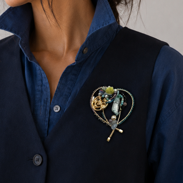 woman wearing wire and bead brooch on navy vest